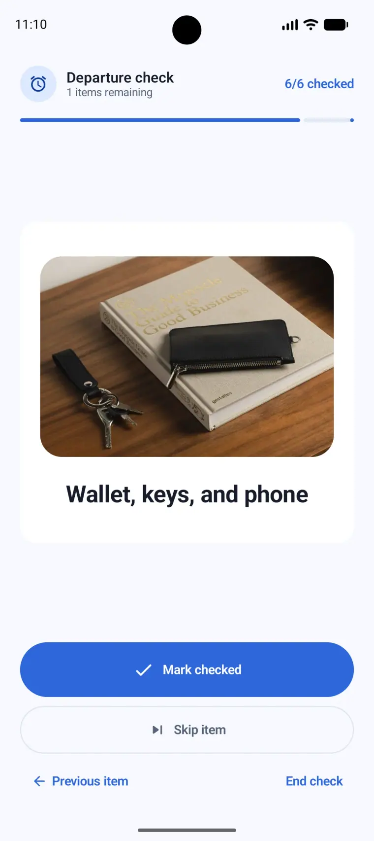 CheckAlarm Android check screen showing a saved photo of a wallet, keys, and phone
